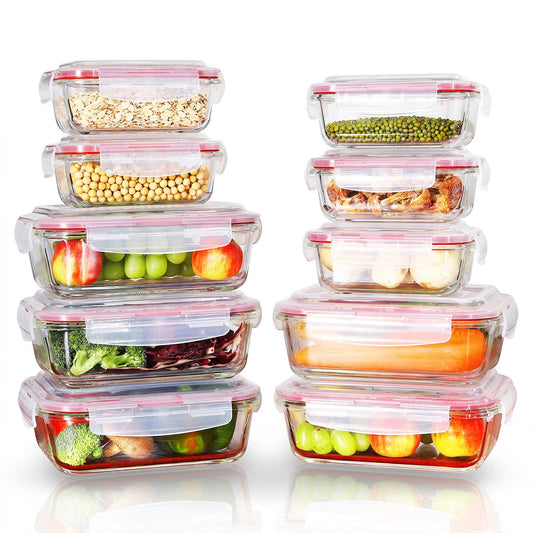Set of glass food storage containers with various foods inside on a white background