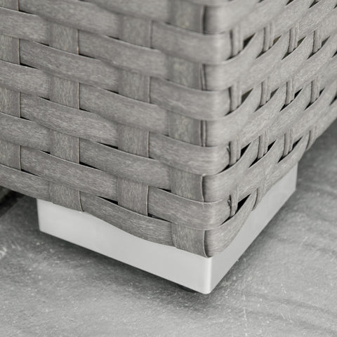 Close-up of a woven basket with a white base on a gray surface