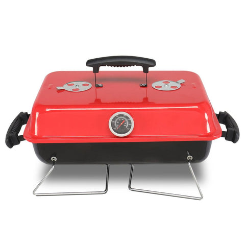 Red portable grill with a black handle on a white background