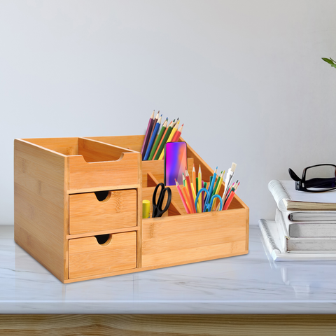 Wooden desk organizer with stationery items on a desk