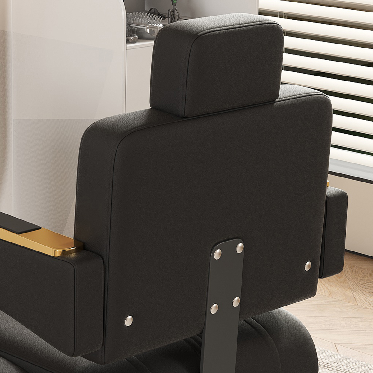 Black barber chair with headrest in a salon setting