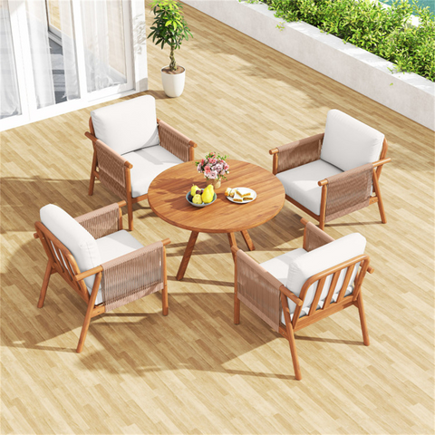 Outdoor furniture set with wooden chairs and table on a deck