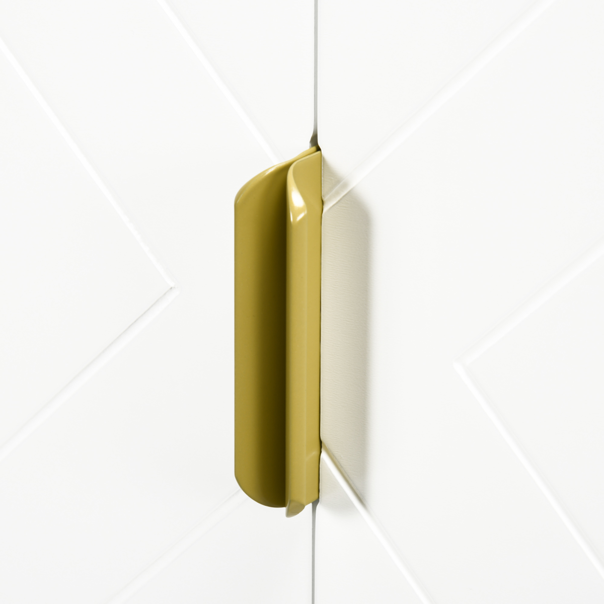 Gold rectangular object on a white geometric background