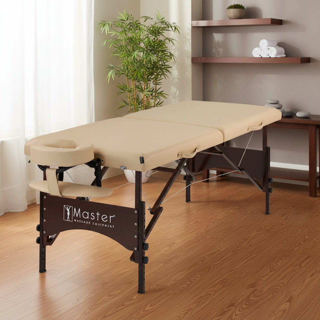 Beige massage table with brown frame on a white background, featuring 'Master Massage Equipment' logo.
