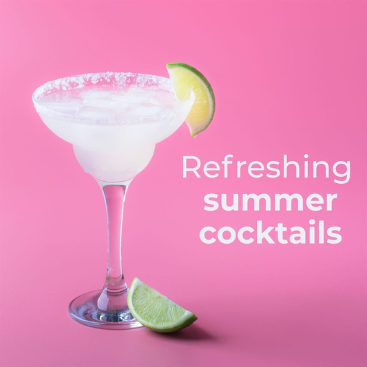 Frozen margarita with lime wedges on a pink background with text 'Refreshing summer cocktails'.