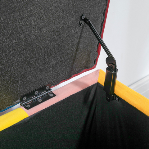 Close-up of a black metal bracket attached to a gray and yellow structure.