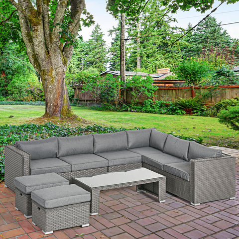 Outdoor patio furniture set with gray cushions on a brick patio